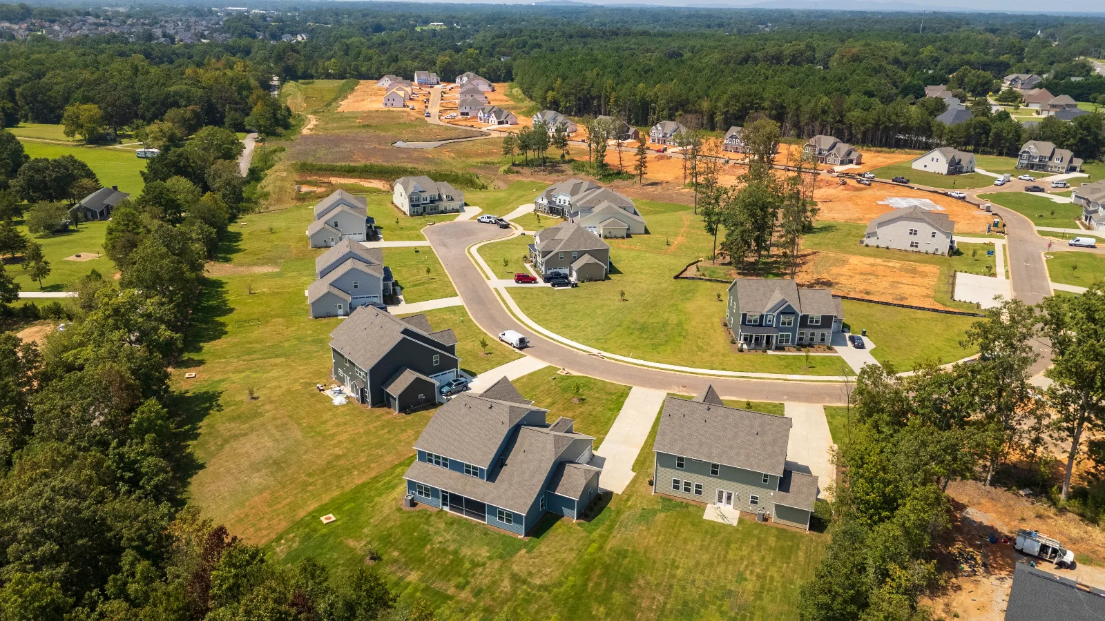 Modern residential land development site representing infrastructure investment Highland Colony Site